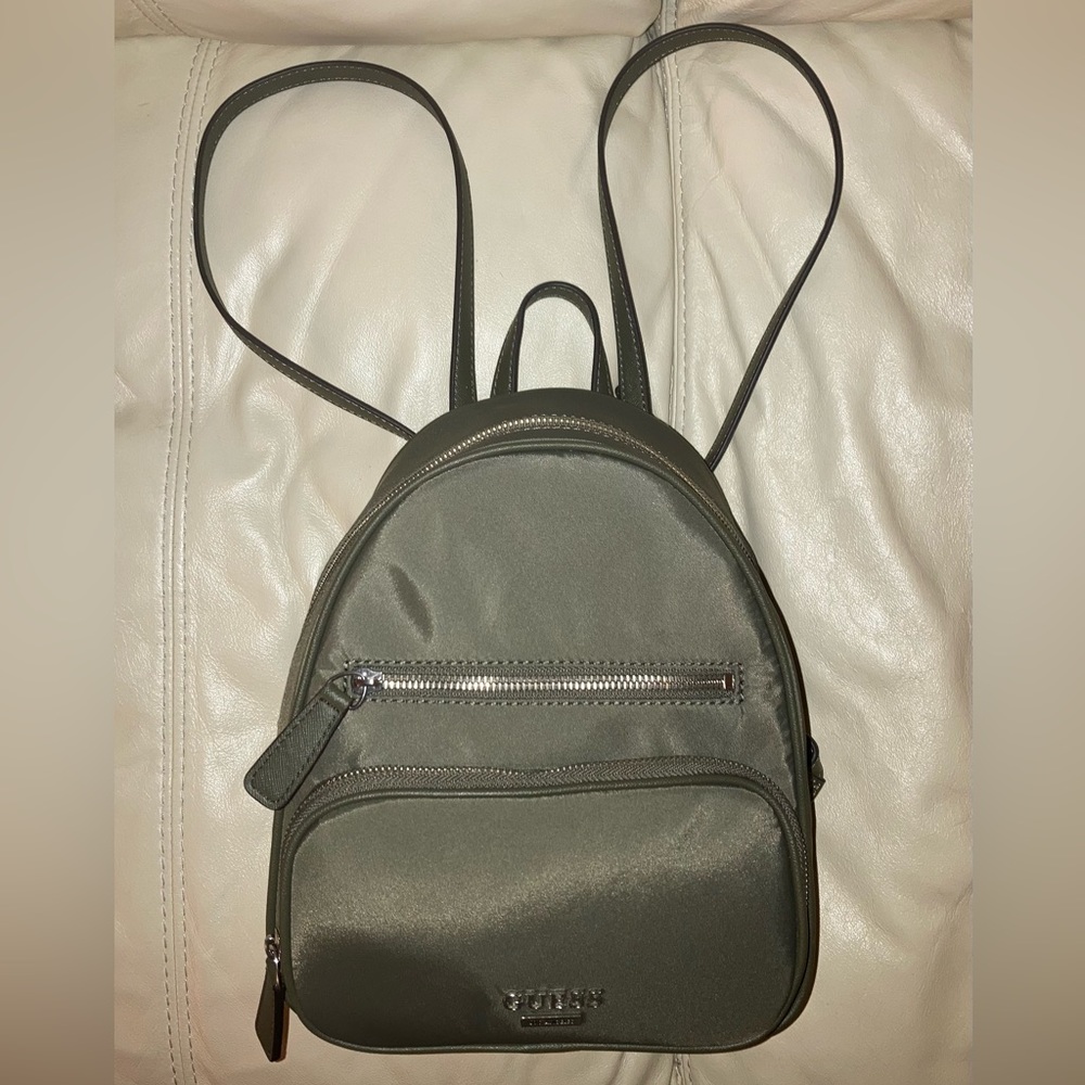 Guess Green Small Nylon Backpack:small discoloration inside by tag. Looks new.